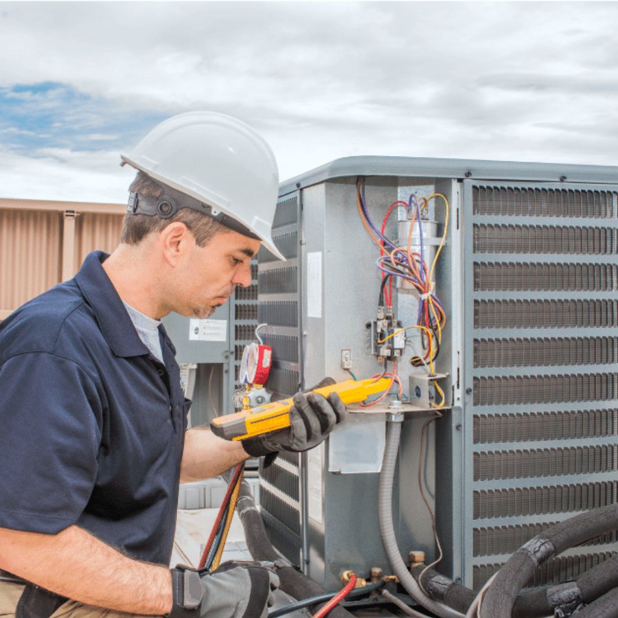 Richmond Hill Heating & Cooling HVAC technician servicing a system